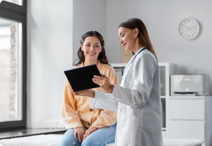 Doctor showing woman results.